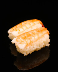 Prawn sushi in a black background