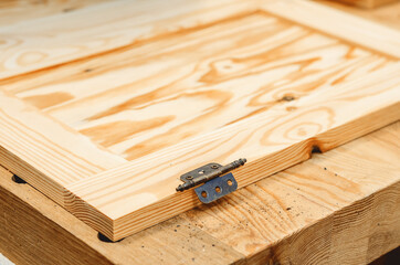 Door hinge is attached to the board