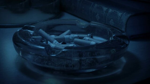 Cigarette Put Out In Ash Tray In The Dark