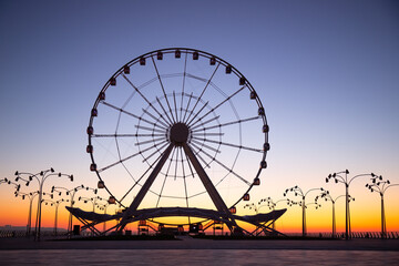 Baku. Azerbaijan. Ferris wheel at sunrise.