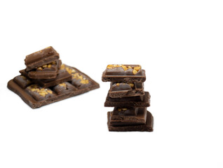 Milk chocolate bar with nuts on a white background.