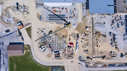 Aerial wide shot of large construction site of high school