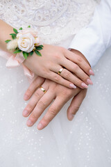 Wedding hands newlywed with golden rings close up