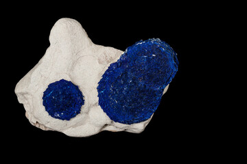 Macro mineral stone Azurite in siltstone against black background