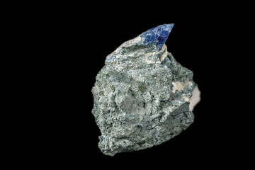 Macro mineral stone Bentorite on a black background