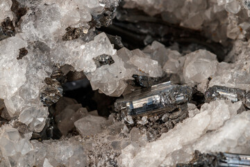 Fototapeta na wymiar Macro mineral stone Stibnite quartz on a black background
