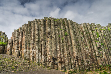 Wall of hexagonal rock formation, interlocking basalt columns in Giants Causeway, Wild Atlantic Way...