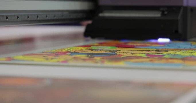Modern Digital Large format UV printer. Printing production technologies. UV pinning is the process of applying a dose of low intensity ultraviolet light to a UV curable ink