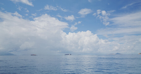 White cloud with blue sky and sea