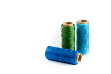 A skein of green, blue and cyan thread. Coils of colored threads on a white background. Waxed...