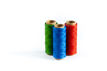 Coils of colored threads on a white background. Waxed sewing thread for leather crafts.
