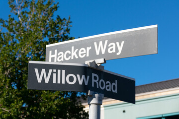 Hacker Way and Willow Road street sign at headquarters of Meta Platforms, Inc., formerly known as...