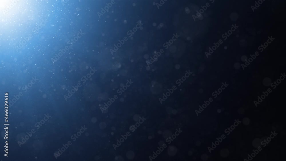 Poster glowing light in the corner of dark blue animation with abstract bokeh and falling glitter motion co