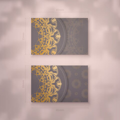 Presentable business card in brown color with mandala gold pattern for your personality.