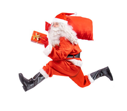 Santa Claus runs with the gifts, isolated on a white background