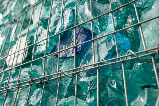 Decorative gabion construction filled with glass waste