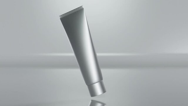 loop animation of plastic tube for cream, Cosmetic white package, gel, lotion, scrub, tonic, toothpaste, body care.  model bottle on gray background slowly rotates in air, alpha channel, 3d render