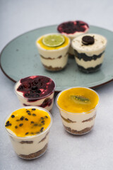 close up of desserts with different flavors on a plate with a marble background
