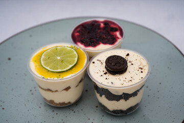 close up of desserts with different flavors on a plate with a marble background