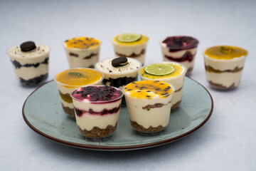 close up of desserts with different flavors on a plate with a marble background