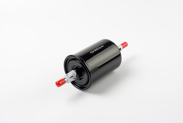 black fuel filter from a car on a white background