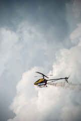 Fototapeta na wymiar Helicopter pirouettes amid rain clouds.