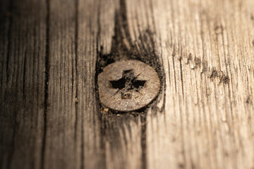 rusty screw and wooden board