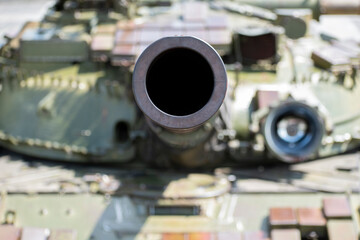 Tank barrel. Looking at the camera. Armored car. tank hull and caterpillar. Cannon shot. heavy...