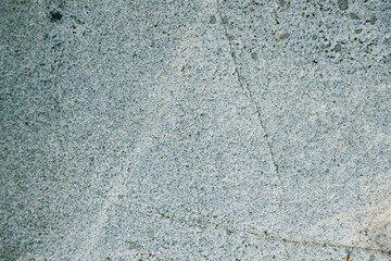 Unusual texture of natural stone with cracks and textures. Natural granite is a mineral stone. Concept - texture for background
