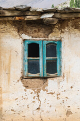 Obraz na płótnie Canvas Window on a traditional home in a mountain village.
