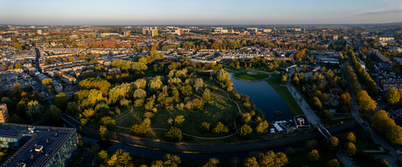 Grift park in Tuinwijk-Oost and Wittevrouwen residential neighbourhood at early morning sunrise. Aerial urban nature cityscape in The Netherlands