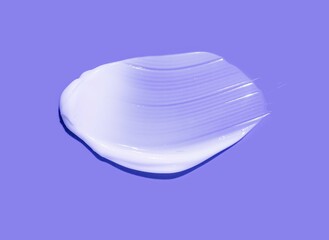 Cosmetic face or body cream hair balm purple colored background