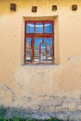 Window on a home in a mountain village.