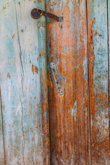 Wooden door on a home in a mountain village.