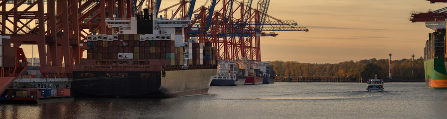 Sunset at a container terminal in the port of hamburg