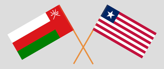 Crossed flags of Oman and Liberia. Official colors. Correct proportion