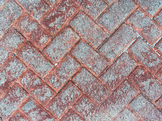 weathered overhead view worn red stone paver cobblestone road street historic diagonal architectural background