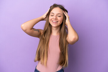 Young Lithuanian woman isolated on purple background laughing