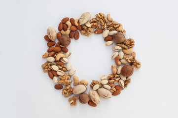 different types of nuts on a white background with a place for the text in the form of a round frame