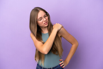 Young Lithuanian woman isolated on purple background suffering from pain in shoulder for having made an effort
