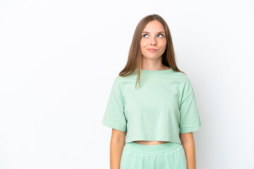 Fototapeta premium Young Lithuanian woman isolated on white background having doubts while looking up