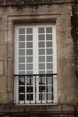 Fototapeta na wymiar Windows of different styles of urban buildings. Spain, Europe