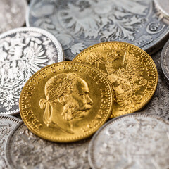 Austro-Hungarian Empire or the Dual Monarchy Gold coins - Close up.Old gold and silver Austrian coins of the 19th century.coin showing austrian emperor Franz Joseph,