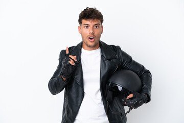 Young caucasian man with a motorcycle helmet isolated on white background intending to realizes the solution while lifting a finger up