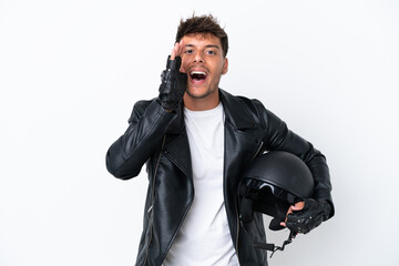 Young caucasian man with a motorcycle helmet isolated on white background shouting with mouth wide open