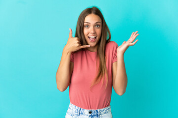 Young woman over isolated blue background making phone gesture and doubting