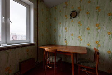 Example of Old Soviet Russian poor interior in Leningrad project House. Aged  sideboard, table,...