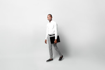 full body of a entrepreneur black man hold laptop go walking isolated background business concept.