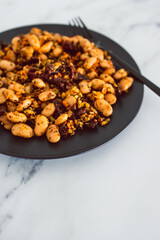 vegan sauted cauliflower rice and butter beans with sundried tomatoes and herbs, healthy plant-based food