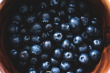 close-up of blueberries in wooden bowl, simple ingredients concept